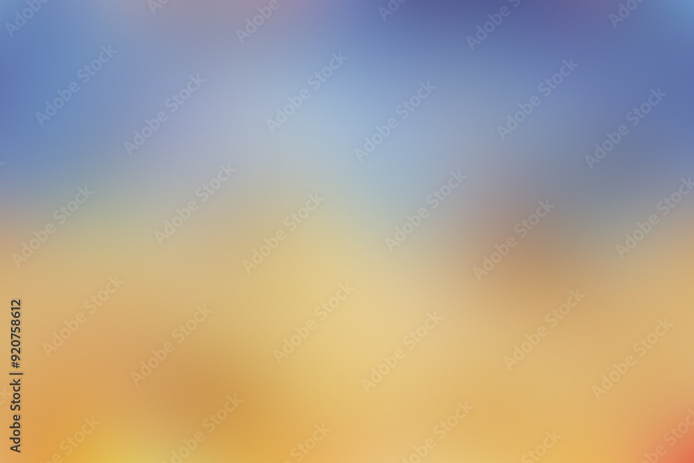 Naklejka premium The sky transitions through vibrant colors as the sun sets over the tranquil ocean, illuminating the sandy beach with warm hues