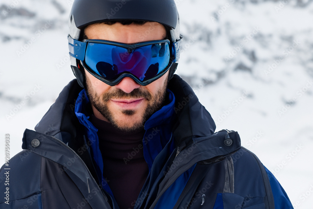 Man in jacket and glasses is preparing for winter. snowboarder holiday portrait concept. a man in a suit and goggles skis. a man in a suit and jacket is skiing in the winter with goggles lifestyle. Man in jacket and glasses is preparing for winter. snowboarder holiday portrait concept. a man in a suit and goggles skis. a man in a suit and jacket is skiing in the winter with goggles lifestyle.