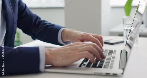 Close up of businessman opening laptop and typing on keyboard at office