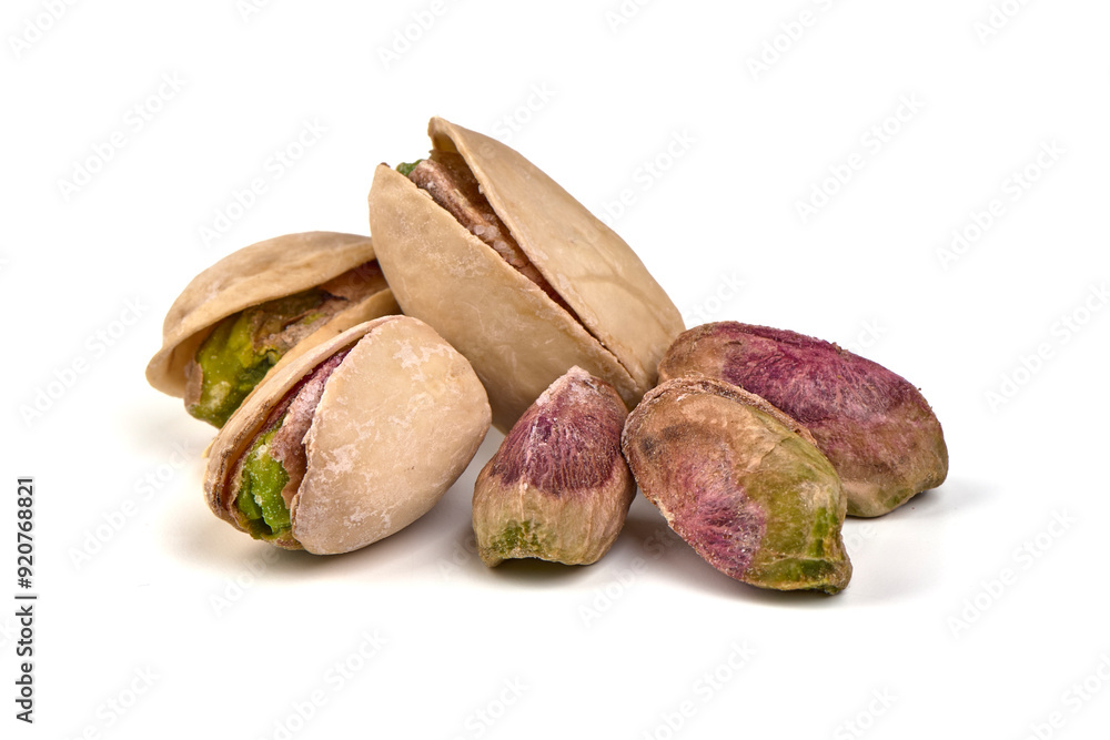 Pistachio nuts, isolated on white background. High resolution image. Pistachio nuts, isolated on white background. High resolution image.