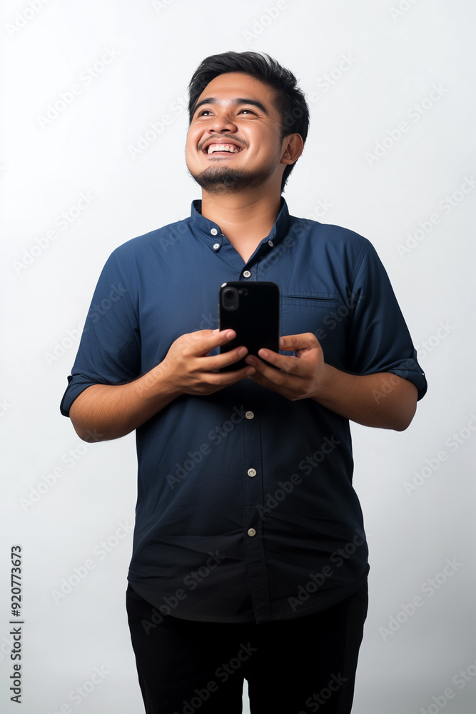 happy asian man holding phone look up happy asian man holding phone look up