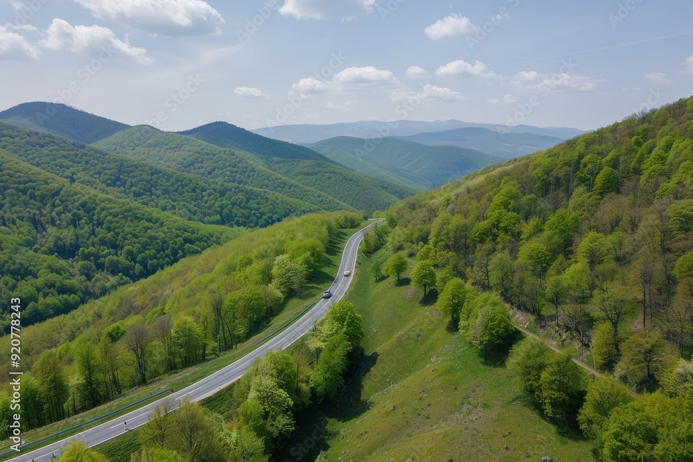 View from above over mountain curvy road in summer, time-lapse with winding road. Beautiful simple AI generated image in 4K, unique. View from above over mountain curvy road in summer, time-lapse with winding road. Beautiful simple AI generated image in 4K, unique.