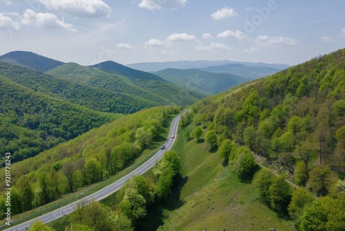 View from above over mountain curvy road in summer, time-lapse with winding road. Beautiful simple AI generated image in 4K, unique.