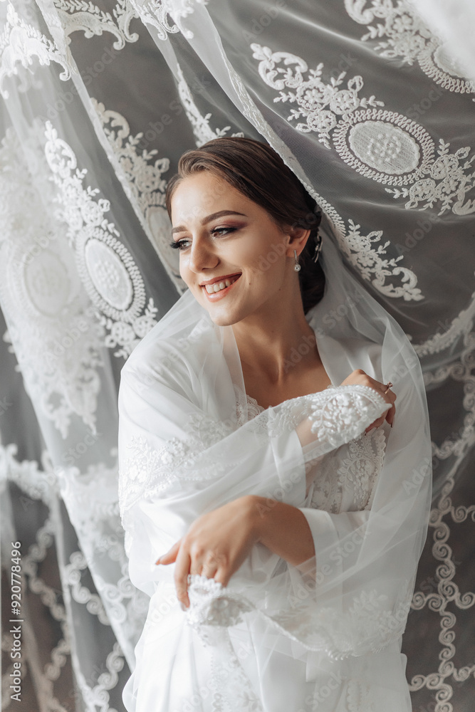 A woman in a white dress is posing for a picture. She is smiling and she is happy A woman in a white dress is posing for a picture. She is smiling and she is happy