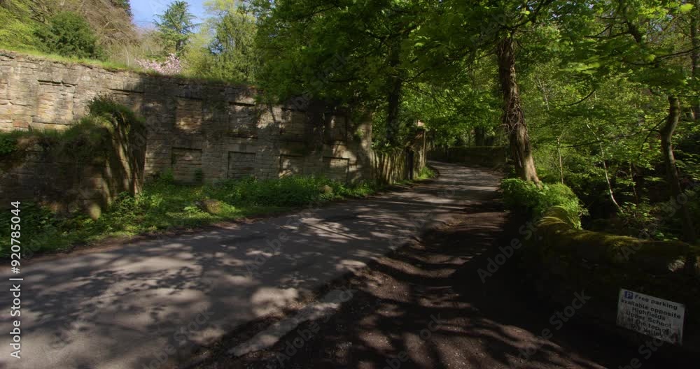 Wide shot of the lower bleaching mill looking up the road at Lumsdale waterfalls, Matlock Wide shot of the lower bleaching mill looking up the road at Lumsdale waterfalls, Matlock