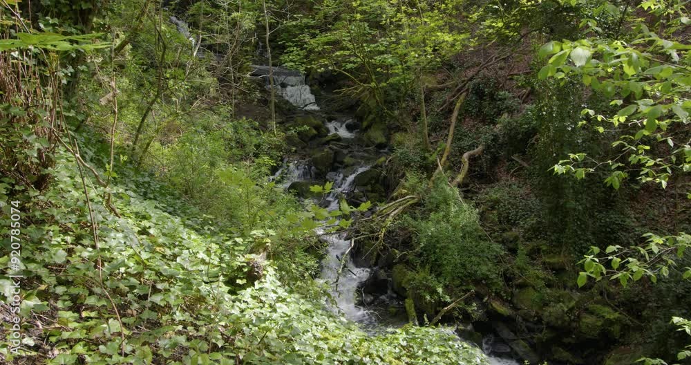 Extra wide shot of water cascading over waterfalls at Lumsdale waterfalls, Matlock Extra wide shot of water cascading over waterfalls at Lumsdale waterfalls, Matlock