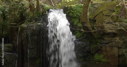 Mid shot looking straight on to the Lumsdale waterfalls with rocks and trees at Lumsdale, Matlock photo