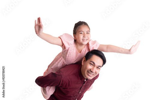 Playful moment between asian father and his adorable daughter as she rides on his back with outstretched arms, symbolizing fun, joy, and a strong father-daughter bond 