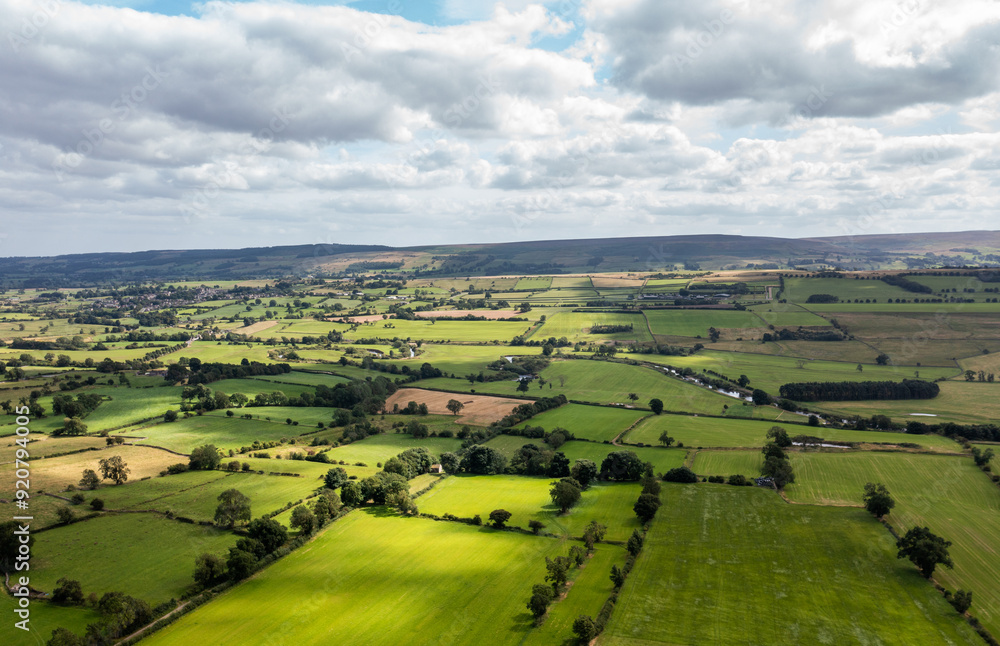 Aerial drone photo of the beautiful town of Leyburn which is a market town and civil parish in North Yorkshire in the UK, showing the houses in the town from above in the summer time