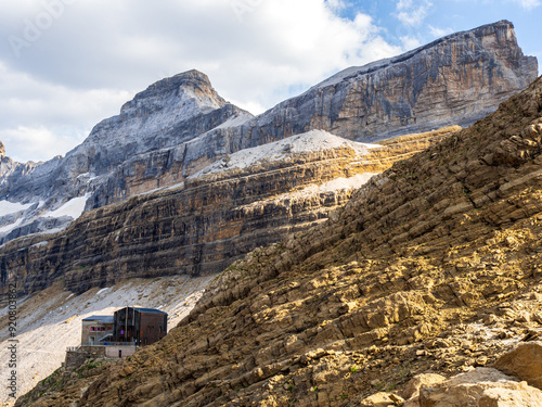 Sunlit Refuge de la Brèche de Roland with Majestic Cirque de Gavarnie in the Pyrénées photo