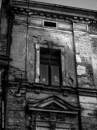 old abandoned building. Smal children behind a window