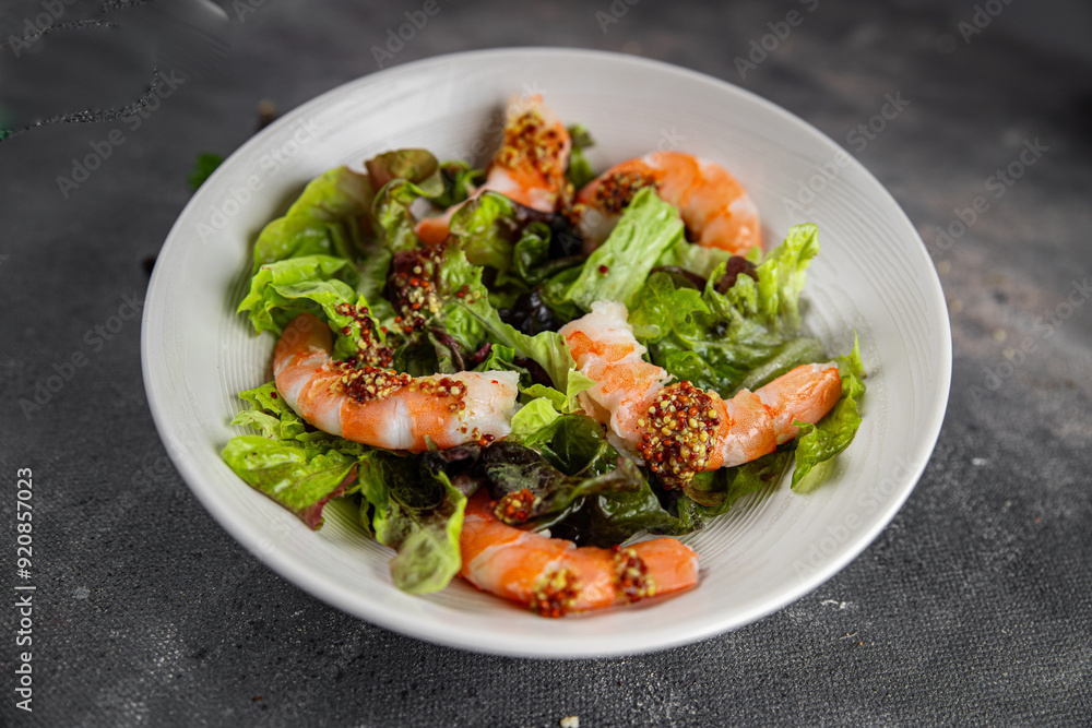 shrimp salad prawns or langoustines green leaf lettuce mix fresh meal food snack on the table copy space food background rustic top view shrimp salad prawns or langoustines green leaf lettuce mix fresh meal food snack on the table copy space food background rustic top view