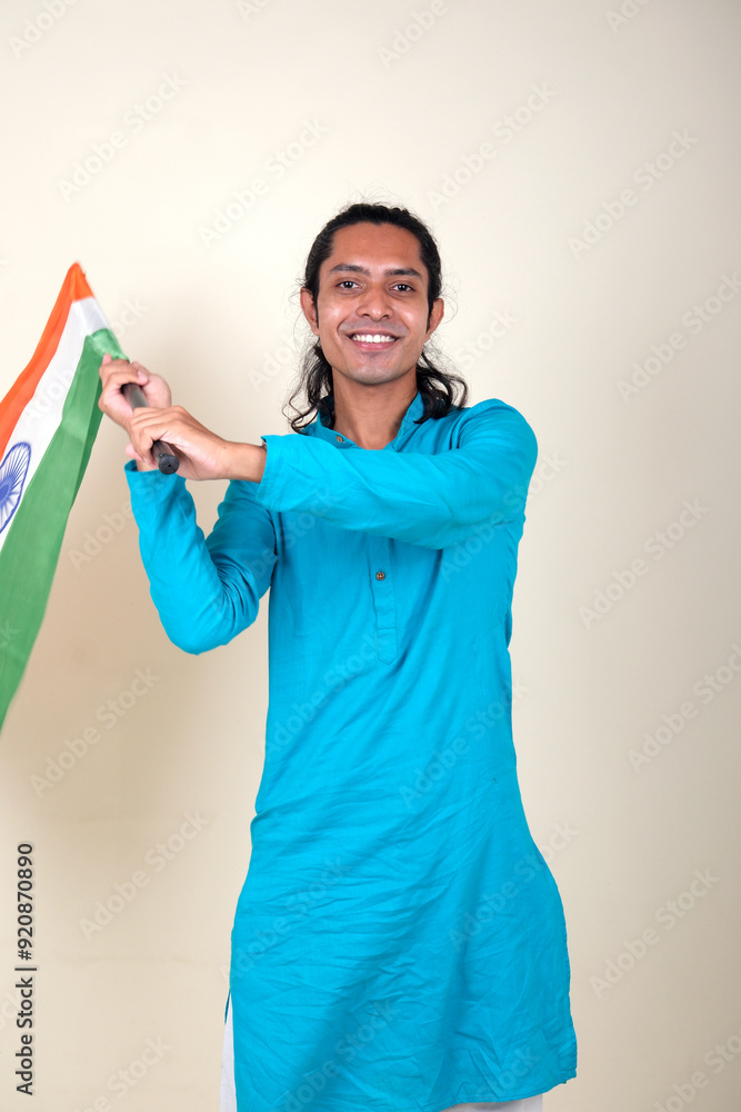 A proud gentleman holding the Indian flag, symbolizing patriotism and national pride. A proud gentleman holding the Indian flag, symbolizing patriotism and national pride.