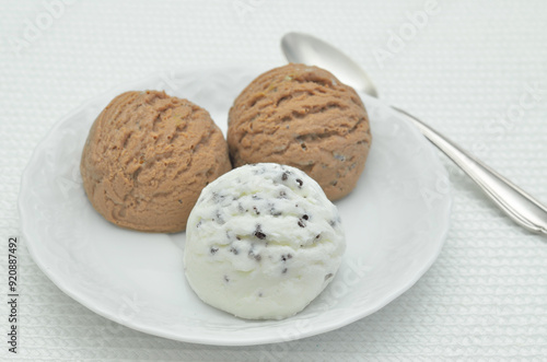 Chocolate ice cream and vanilla ice cream on white plate