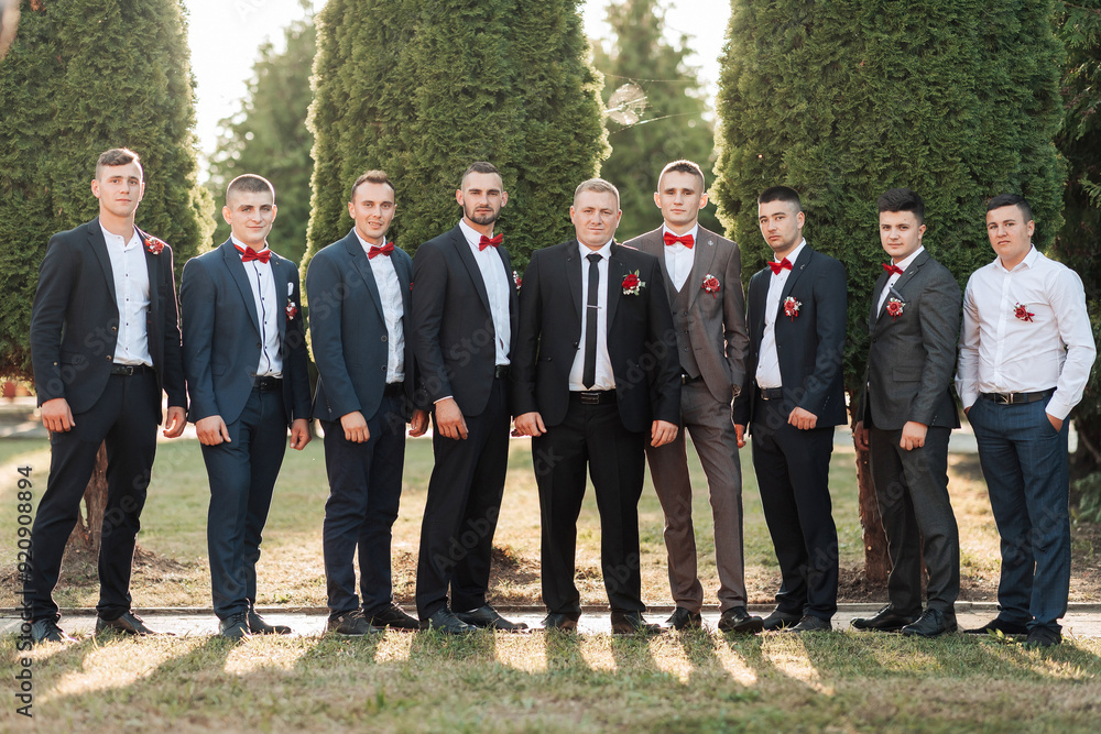 A group of men in suits and ties pose for a photo A group of men in suits and ties pose for a photo