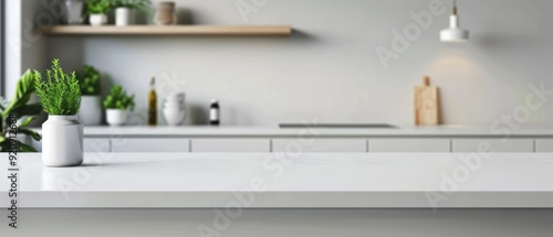 Blurred white kitchen interior with empty countertop for product display, blurred background photo