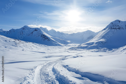 A breathtaking view of a vast snow-covered mountain range, illuminated by glistening sunlight—a true winter paradise waiting to be explored.