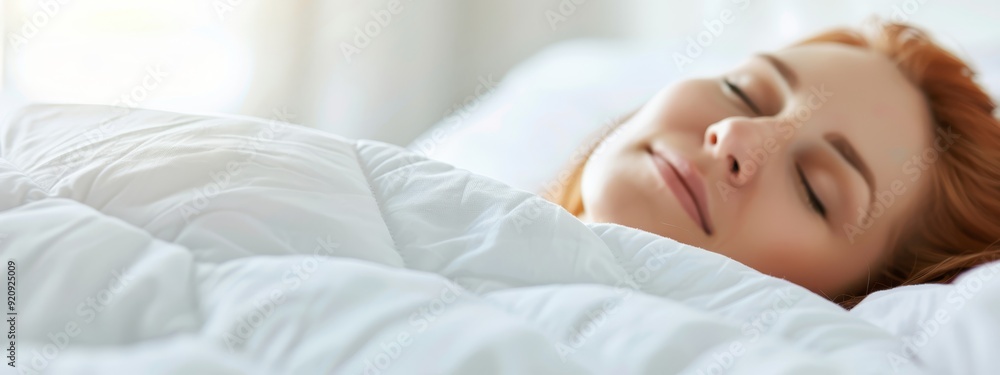 A tight shot of a person reclining on a bed with a white comforter and crisp sheets, a window providing the backdrop A tight shot of a person reclining on a bed with a white comforter and crisp sheets, a window providing the backdrop