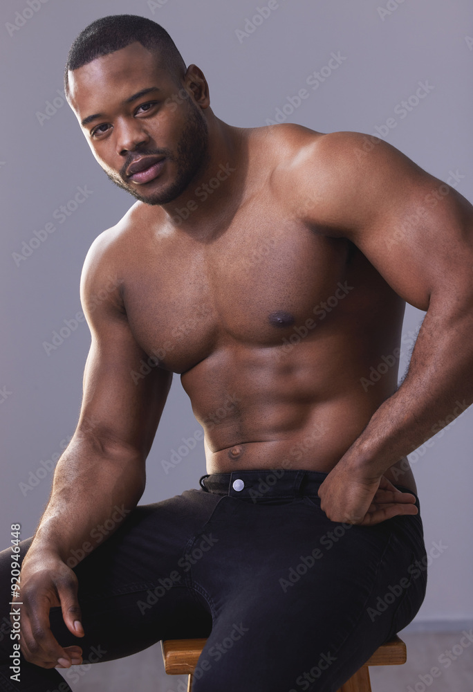 Fototapeta premium Exercise, muscles and portrait of black man in studio isolated on purple background for health or strength. Fitness, macho and power with body of confident athlete, shirtless for physical improvement
