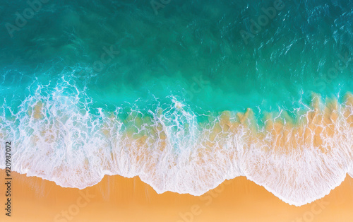 Aerial view of a beautiful tropical beach with turquoise waves crashing onto the sandy shore, creating a picturesque and tranquil coastal scene.