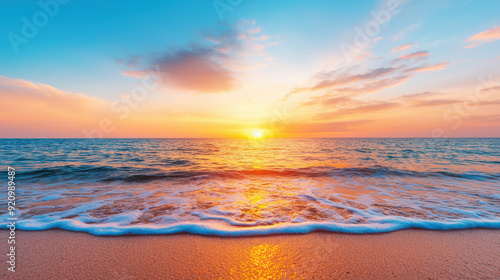 Vibrant sunset over a serene beach with gentle waves, golden sand, and colorful clouds in the sky, capturing a tranquil moment in nature.