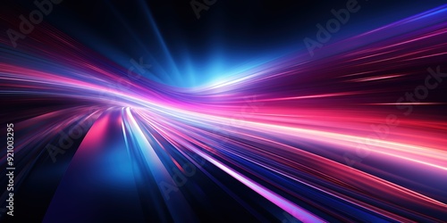 Abstract blue and pink light streaks on a dark background.