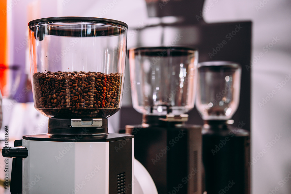 Professional coffee grinders in a bar of coffee shop.