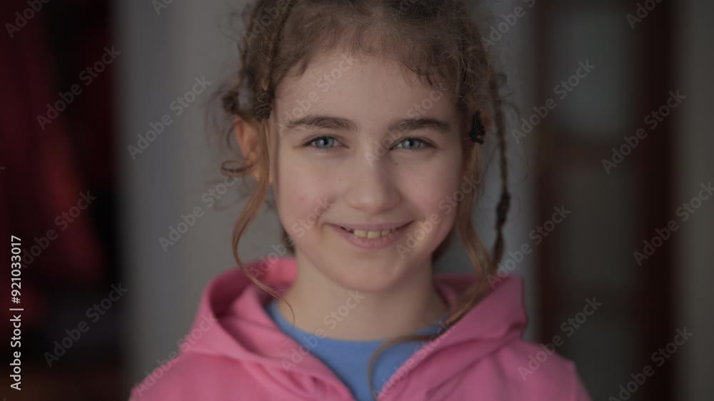 Teenage Girl With Stylish Hairstyle in Pink Hoodie Looks at Camera. Portrait Funny Little Girl Smiling Child. Face Contemplative Child Cute Pretty Schoolgirl Elementary Student. Positive Emotions. Teenage Girl With Stylish Hairstyle in Pink Hoodie Looks at Camera. Portrait Funny Little Girl Smiling Child. Face Contemplative Child Cute Pretty Schoolgirl Elementary Student. Positive Emotions.