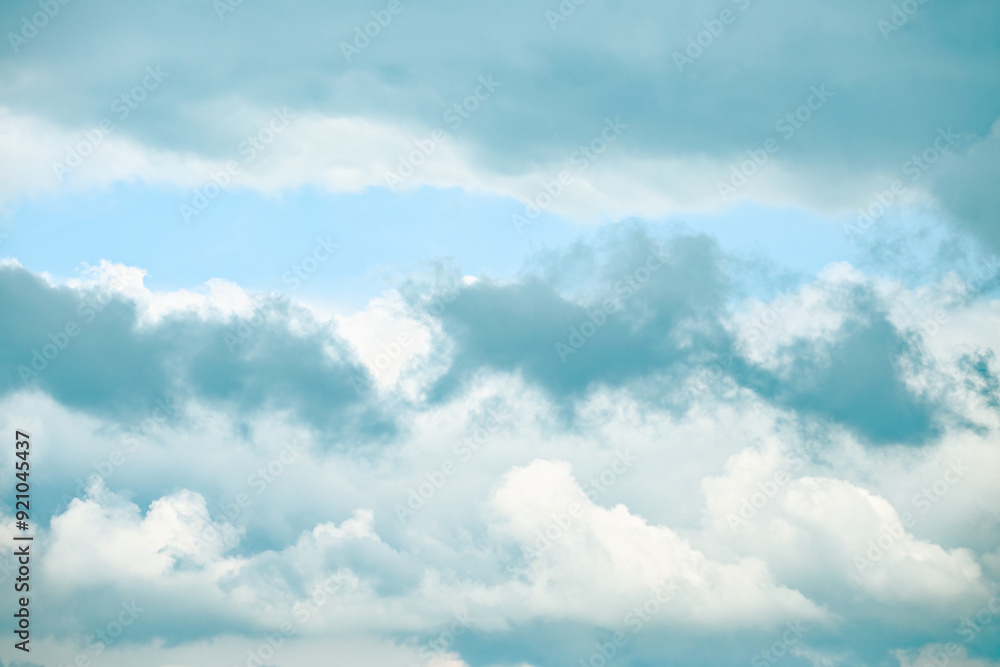 The sky is overcast, hiding the sun from view. The clouds are a blend of white and grey. The sky is overcast, hiding the sun from view. The clouds are a blend of white and grey.