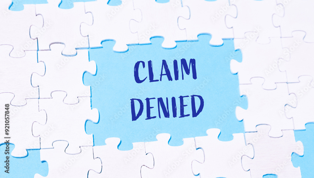 A jigsaw puzzle with the word claim written in blue letters A jigsaw puzzle with the word claim written in blue letters