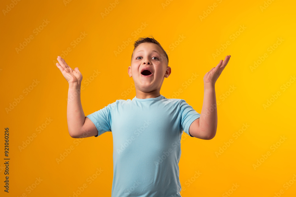 Surprised child boy with opened mouth on yellow background. Surprised child boy with opened mouth on yellow background.