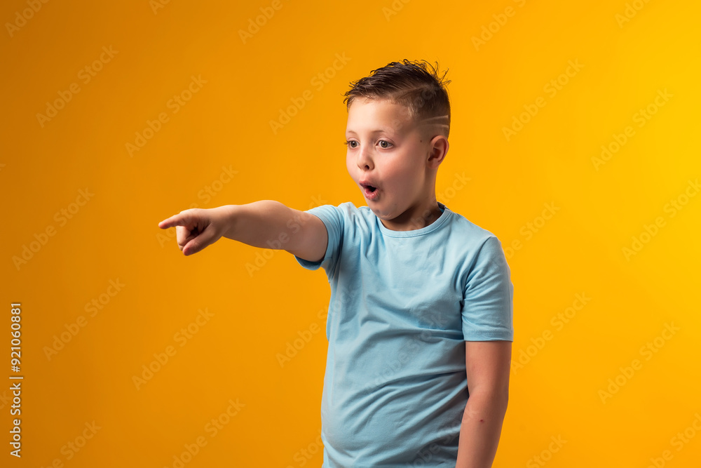 Kid boy mocking and teasing at someone showing finger at camera. Bulling concept Kid boy mocking and teasing at someone showing finger at camera. Bulling concept