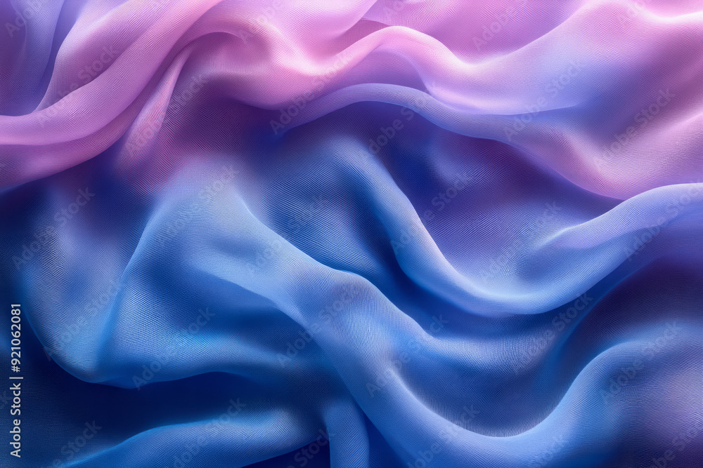 Obraz premium A close-up of smooth blue and purple fabric swirling together, capturing the texture and softness of the material,