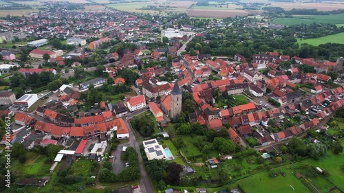 A wide Aerial view of the old town of the city Oebisfelde on a late summer afternoon in Germany.	 photo