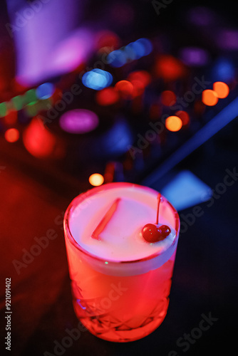 A cocktail in front of the DJ console. Party at the bar.