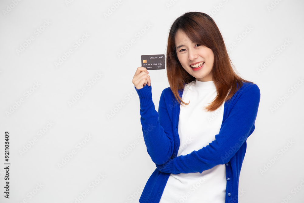 Happy young Asian woman showing credit card isolated on white background Happy young Asian woman showing credit card isolated on white background