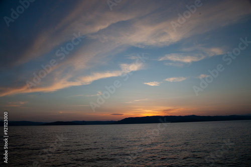 Sunlight sky over a lake during sunset hours