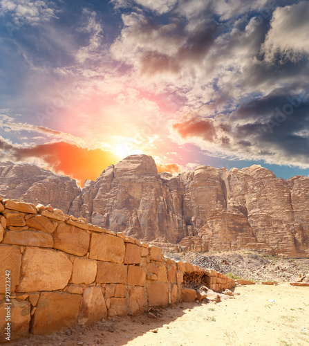 Mountains of Wadi Rum Desert also known as The Valley of the Moon is a valley cut into the sandstone and granite rock in southern Jordan 60 km to the east of Aqaba photo