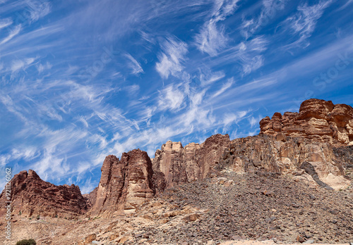 Mountains of Wadi Rum Desert also known as The Valley of the Moon is a valley cut into the sandstone and granite rock in southern Jordan 60 km to the east of Aqaba