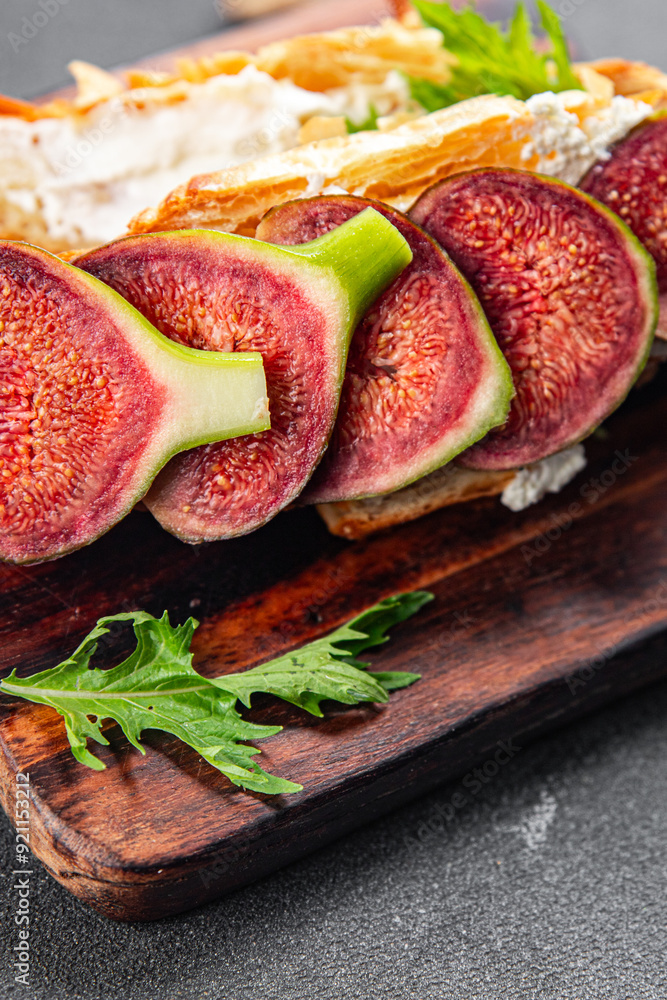Fig sandwich croissant, cream cheese fresh meal food snack on the table copy space food background rustic top view Fig sandwich croissant, cream cheese fresh meal food snack on the table copy space food background rustic top view