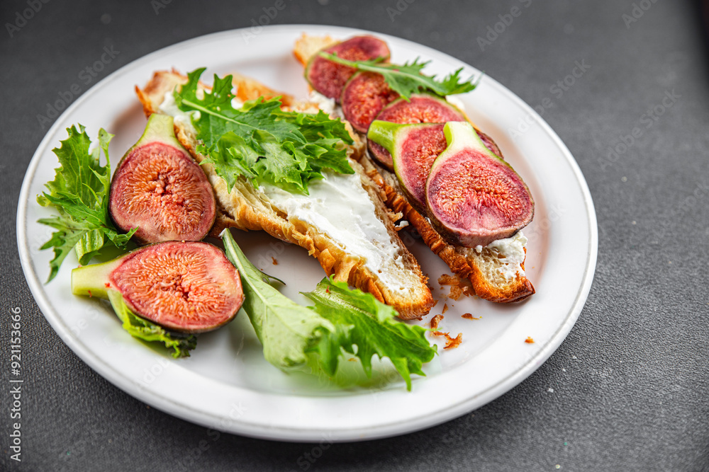 Fig sandwich croissant, cream cheese fresh meal food snack on the table copy space food background rustic top view Fig sandwich croissant, cream cheese fresh meal food snack on the table copy space food background rustic top view