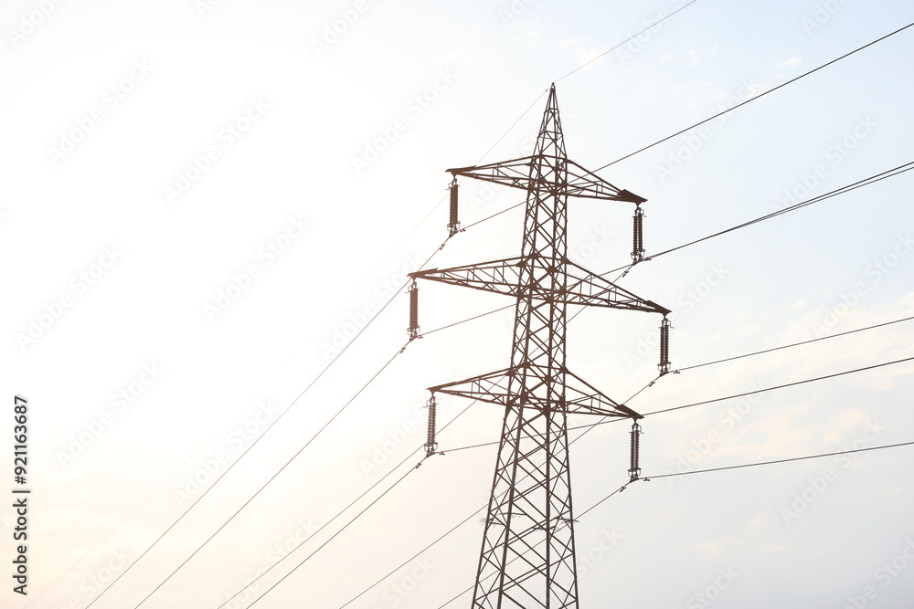 power lines with cloudy sky
