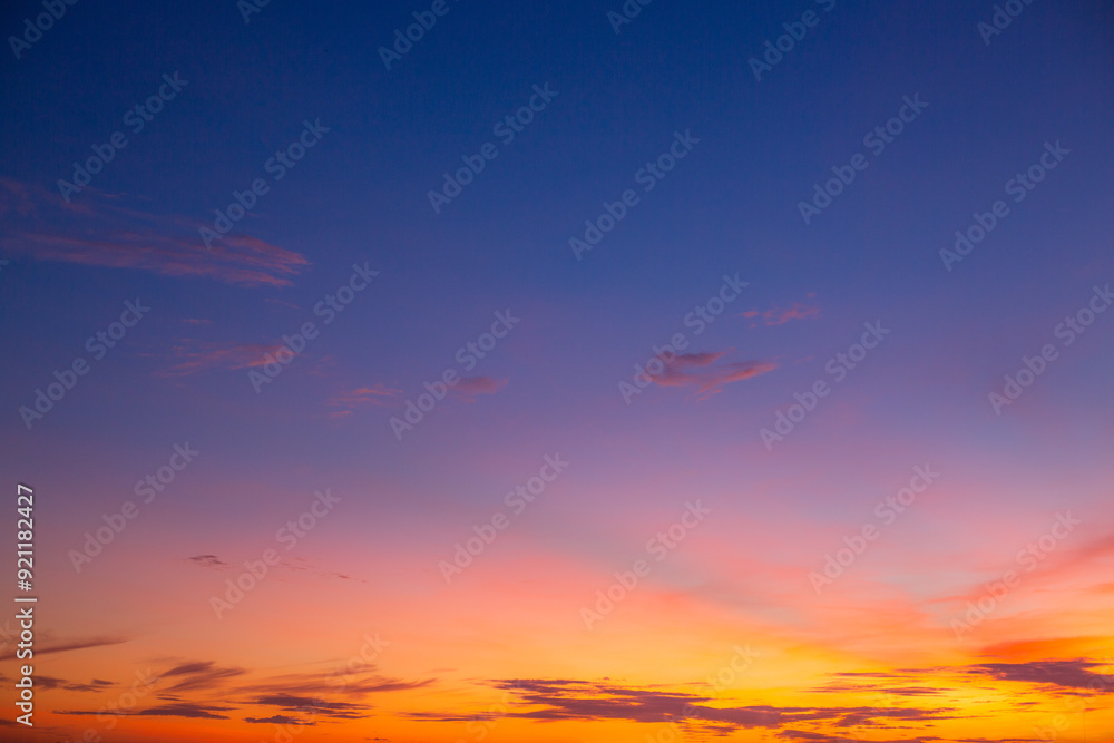 Colorful clouds and sky. Dusk and sunset. Evening clouds with orange, yellow, pink and red sunlight and amazing storm clouds in the dusk sky. Colorful clouds and sky. Dusk and sunset. Evening clouds with orange, yellow, pink and red sunlight and amazing storm clouds in the dusk sky.