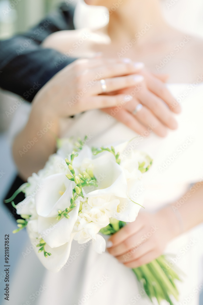 The hands of the newlyweds, the gentle touches, the golden rings. The hands of the newlyweds, the gentle touches, the golden rings.