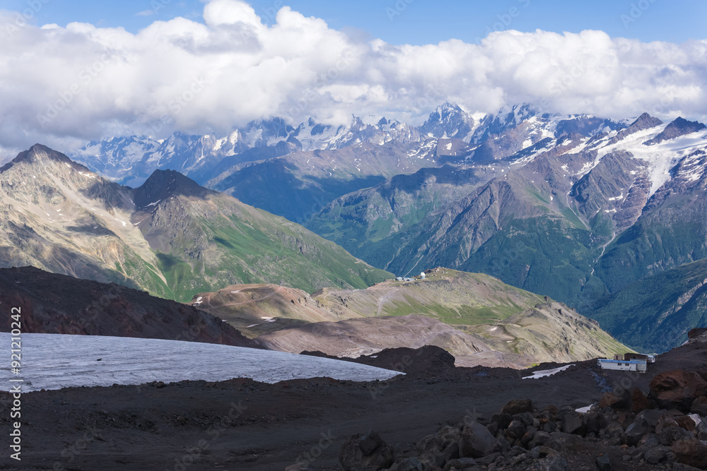 view of the Caucasus Mountains in the clouds from the slope of Mount Elbrus view of the Caucasus Mountains in the clouds from the slope of Mount Elbrus