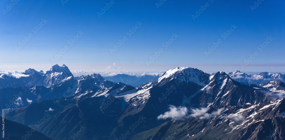 panoramic view of snowy high mountain peaks, Caucasus ridge. panoramic view of snowy high mountain peaks, Caucasus ridge.