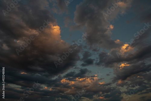 Cloudscape, Colored Clouds at Sunset near the Ocean in a Cloudy Day