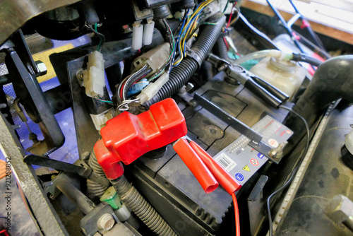 Charging a tractor battery - red and black terminals connected
