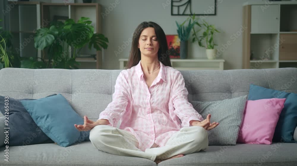 Cozy living room meditation scene with woman Cozy living room meditation scene with woman