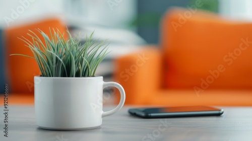 Cozy Living Room With Coffee Mug, Tablet, and Decorative Flowers on a Table
